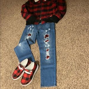 Jeans with red buffalo plaid peekaboo patchwork.